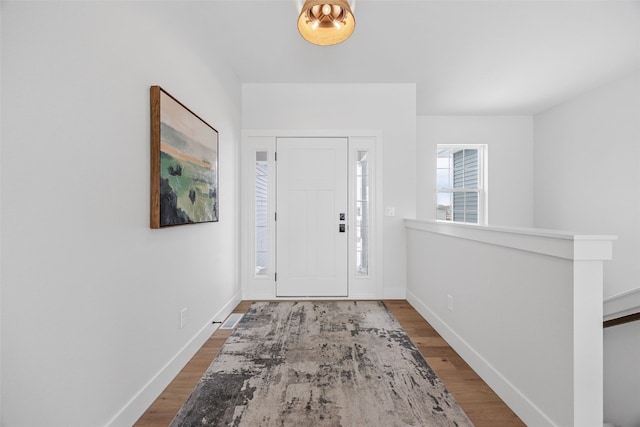 entrance foyer featuring hardwood / wood-style floors