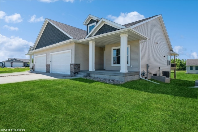 view of front facade with a porch, a front yard, and a garage