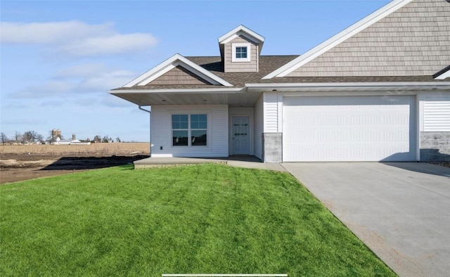 view of front of home with a garage and a front yard