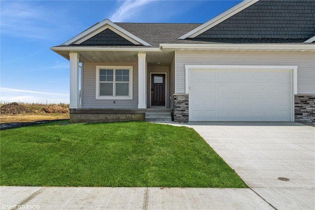 view of front of house with a front lawn and a garage