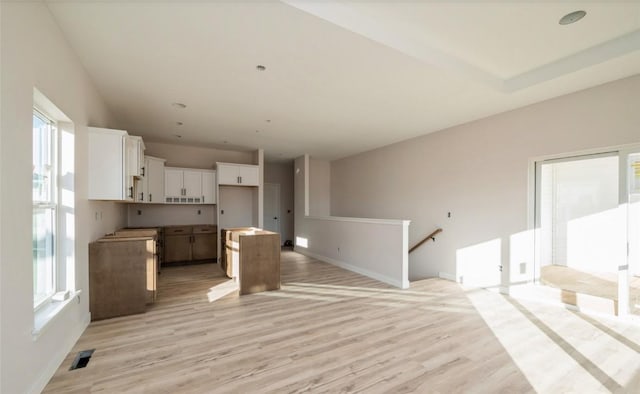 unfurnished living room featuring light hardwood / wood-style flooring