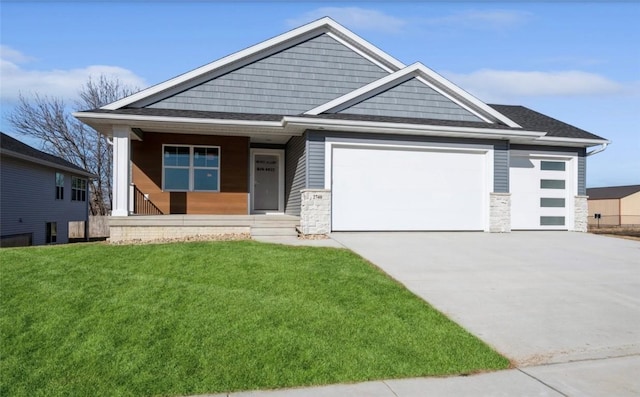 view of front of house with a garage and a front yard