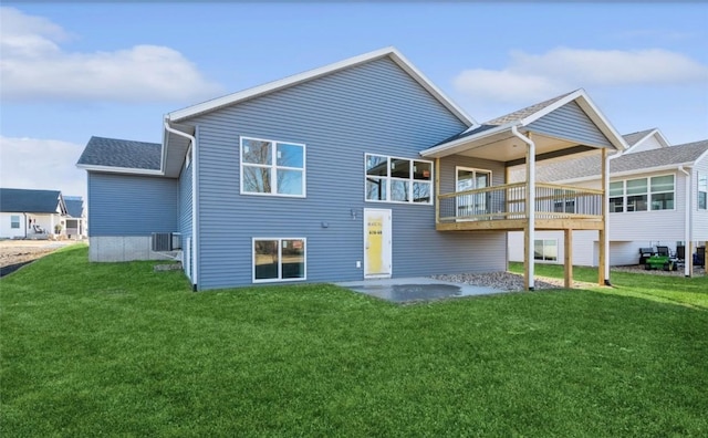 rear view of property with a patio area, a lawn, and central air condition unit