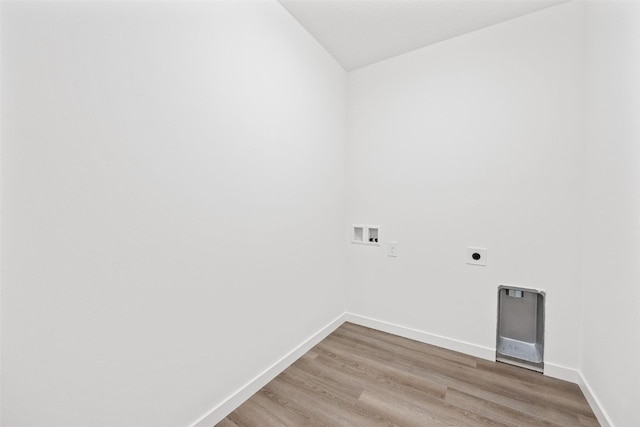 washroom featuring electric dryer hookup, hardwood / wood-style flooring, and hookup for a washing machine