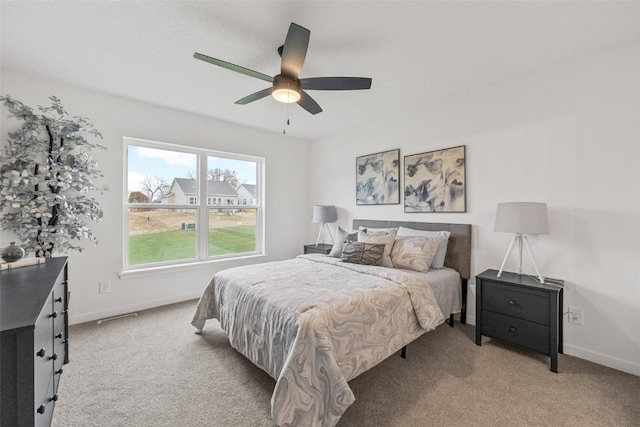 bedroom featuring ceiling fan and light colored carpet