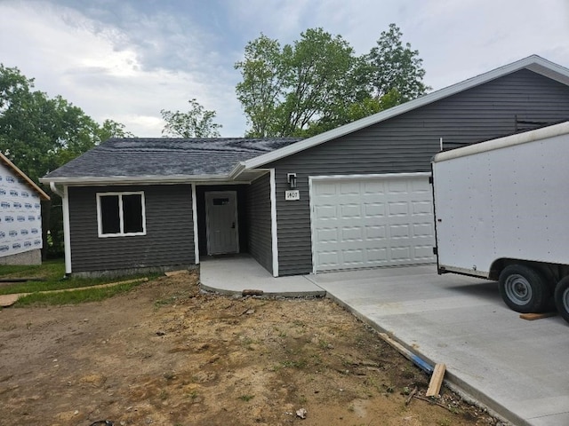 single story home featuring a garage