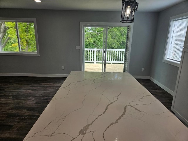 spare room with dark wood-type flooring