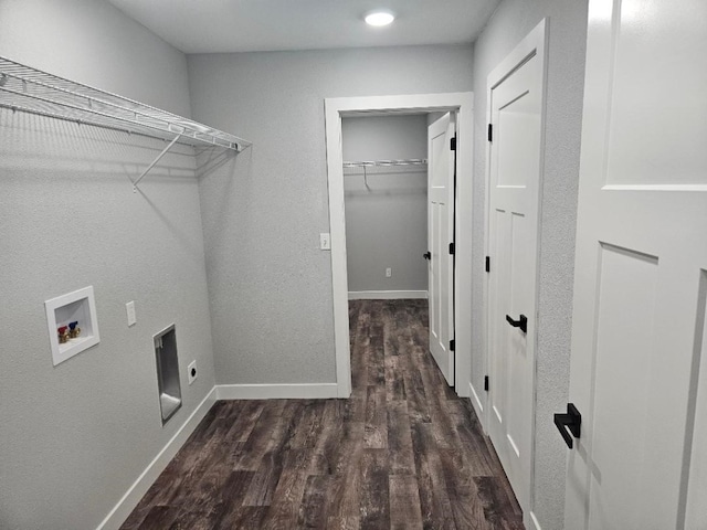 washroom with hookup for an electric dryer, washer hookup, and dark hardwood / wood-style flooring