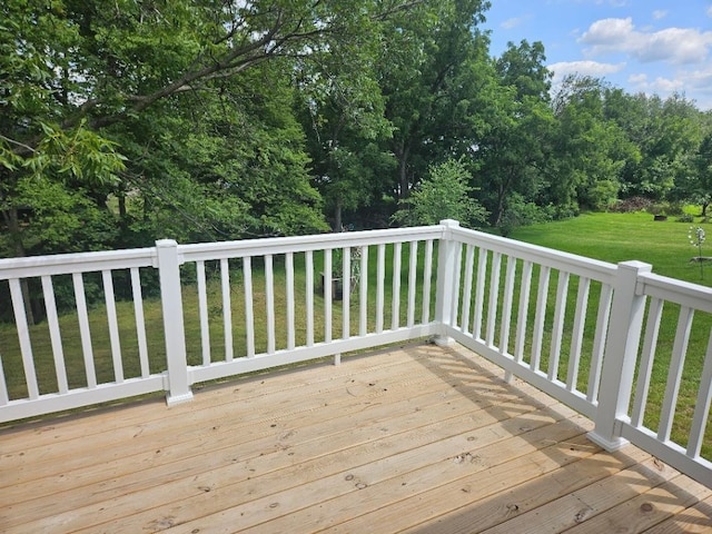 wooden terrace with a yard