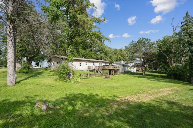 view of yard with a wooden deck