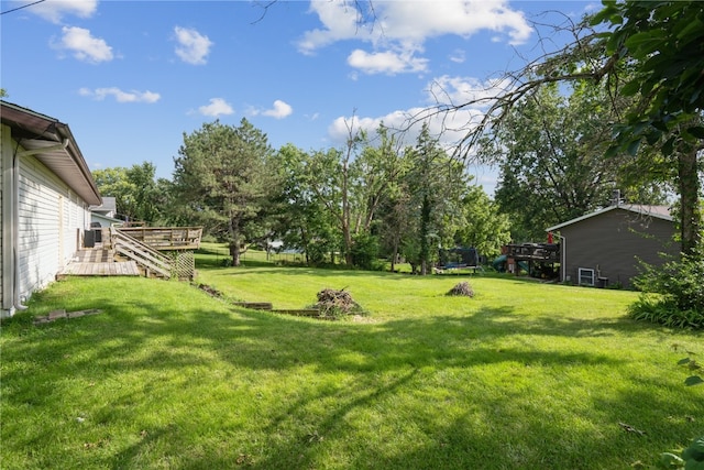 view of yard with a wooden deck