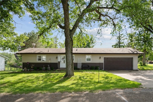 single story home with a front yard and a garage