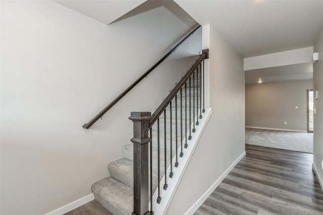 stairway featuring hardwood / wood-style floors