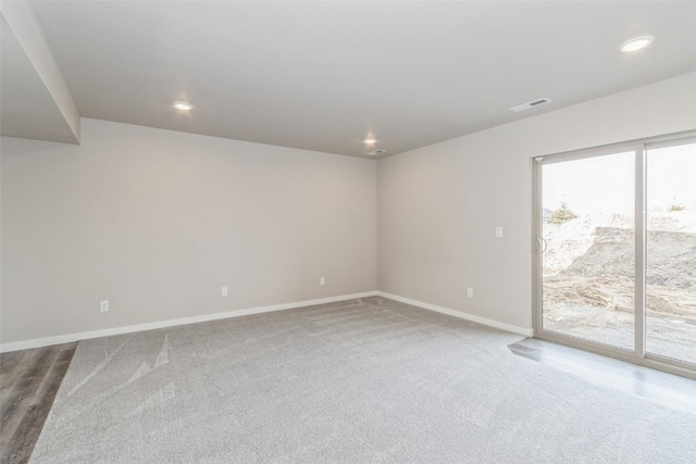 carpeted spare room with a healthy amount of sunlight