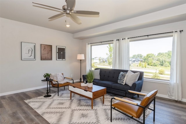 living room featuring wood-type flooring and ceiling fan