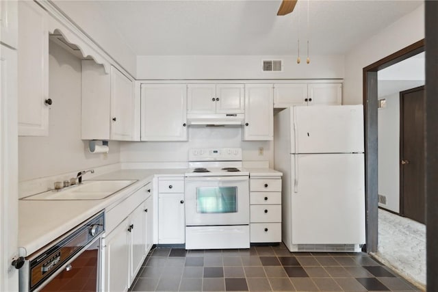 kitchen featuring ceiling fan, sink, white cabinets, and white appliances