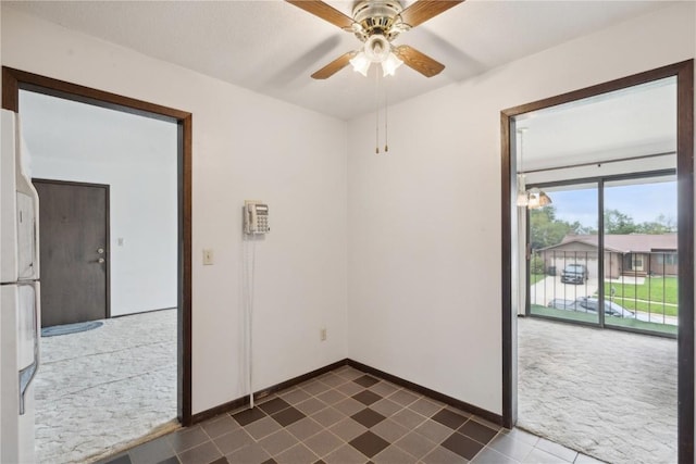 carpeted empty room with ceiling fan