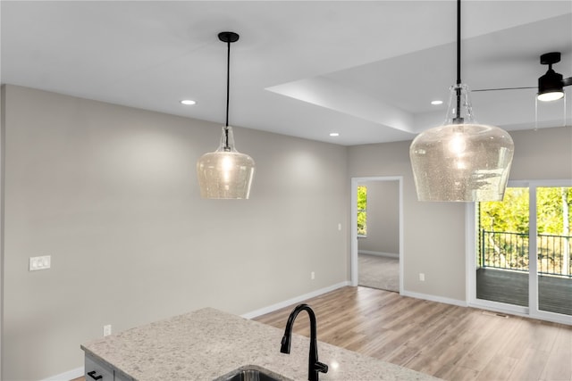 dining area featuring light wood-type flooring and plenty of natural light