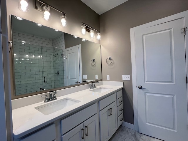 bathroom featuring vanity and a shower with shower door