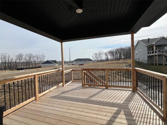 wooden terrace featuring ceiling fan