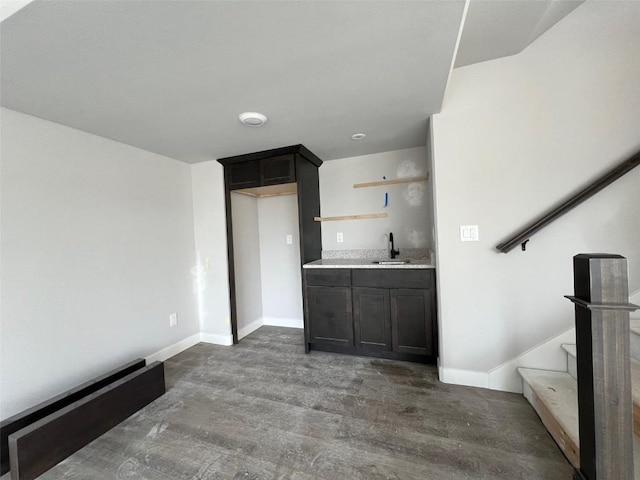 interior space with dark hardwood / wood-style flooring and sink