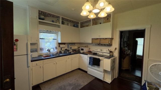 kitchen with white cabinetry, sink, white appliances, and an inviting chandelier