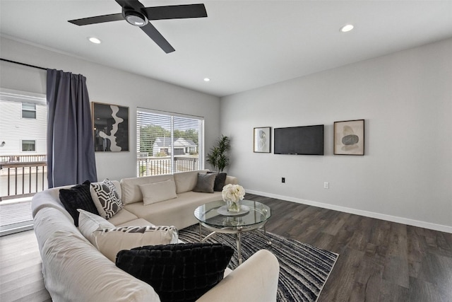 living room featuring ceiling fan and wood-type flooring