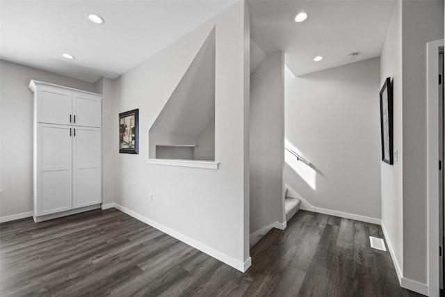 foyer entrance with dark hardwood / wood-style floors