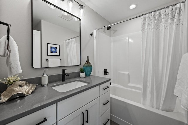 bathroom featuring vanity and shower / bath combo with shower curtain