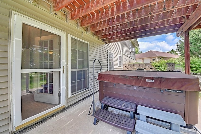 view of patio / terrace with a hot tub