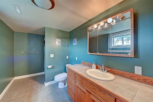 bathroom with tile patterned flooring, toilet, baseboards, and visible vents