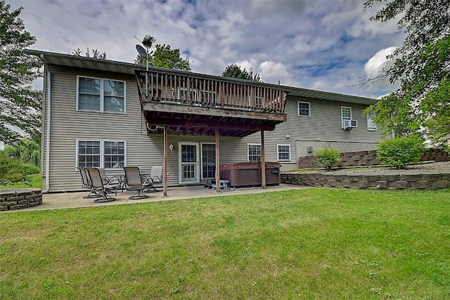 back of property with a lawn, cooling unit, a hot tub, and a patio