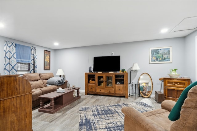 living room featuring light hardwood / wood-style flooring and cooling unit