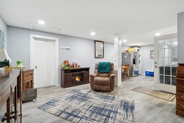 sitting room featuring light hardwood / wood-style flooring