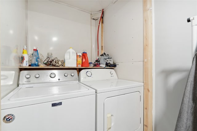 washroom featuring independent washer and dryer