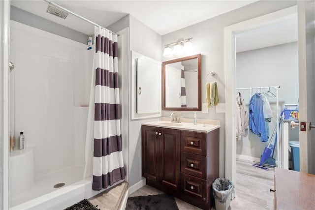 bathroom featuring vanity and walk in shower