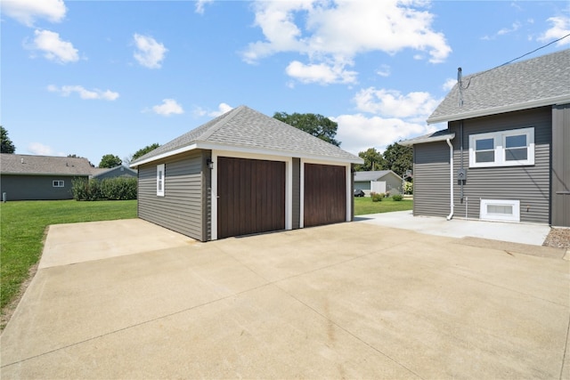 garage featuring a lawn