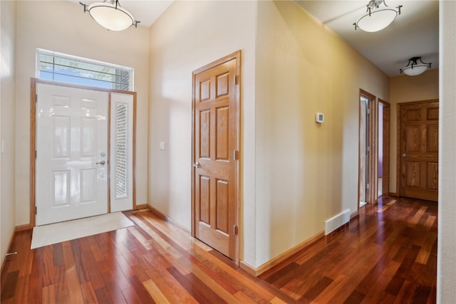 entryway with hardwood / wood-style flooring