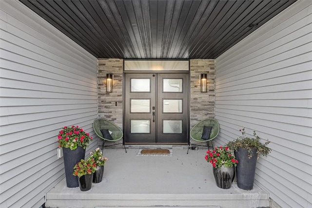 entrance to property with stone siding