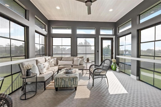 sunroom / solarium with ceiling fan and wooden ceiling