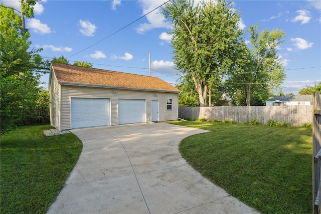 exterior space featuring a garage and an outbuilding