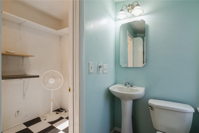 bathroom featuring sink and toilet