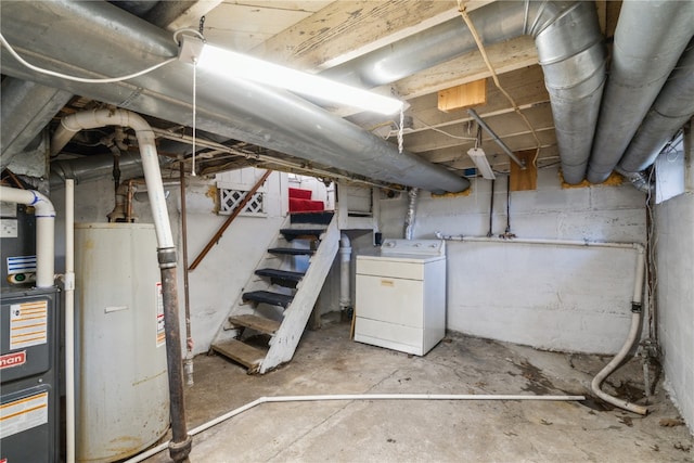 basement with gas water heater and washer / dryer