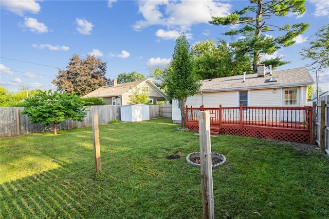 view of yard with a wooden deck