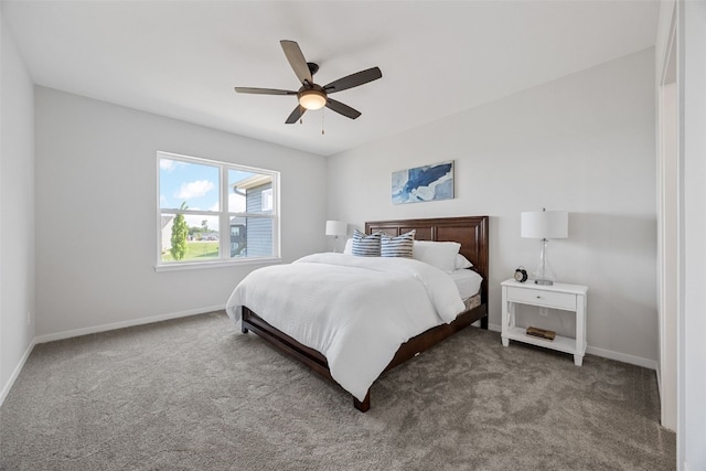 5638 Meadow Grass Cir SE, Cedar Rapids, IA 52403 - bedroom featuring carpet, baseboards, and a ceiling fan