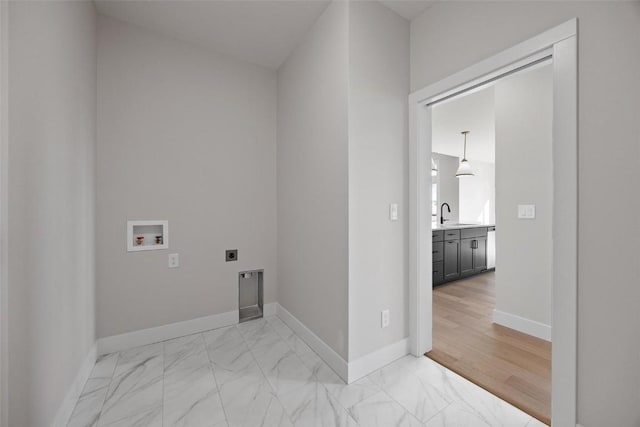 laundry area featuring hookup for a washing machine, sink, and hookup for an electric dryer