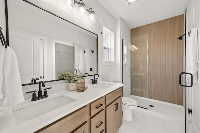 full bath with double vanity, a stall shower, and a sink
