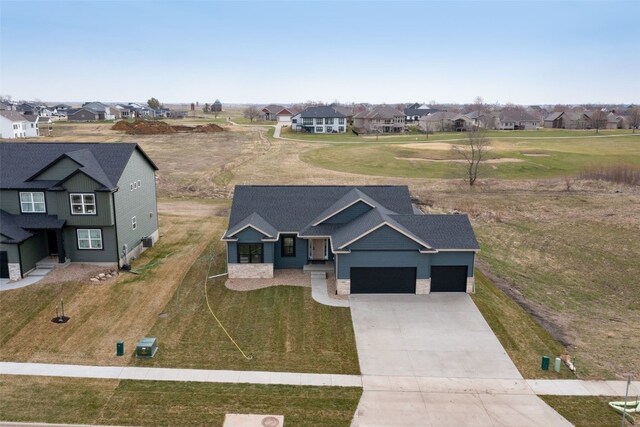 birds eye view of property with a residential view