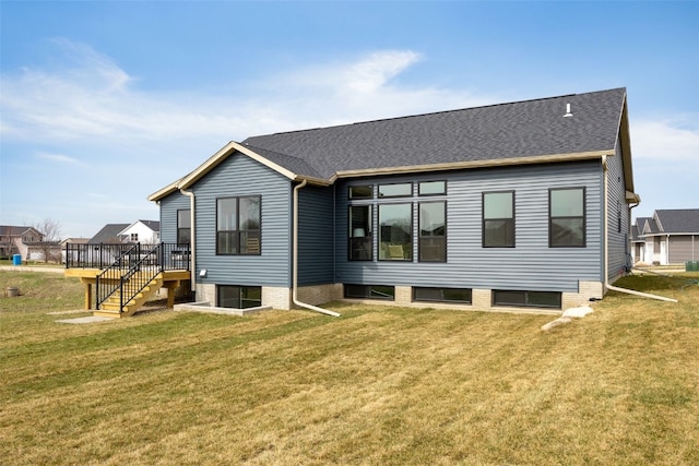 back of house with stairway, a deck, and a yard