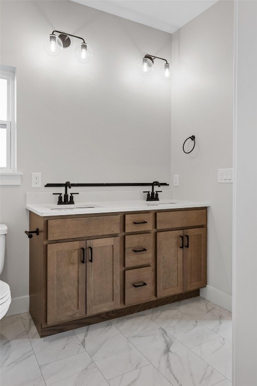 bathroom featuring vanity and toilet